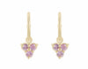 Trio of pink sapphire drops hung on yellow gold hoops.