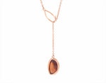 Hessonite garnet pendant, odd shape, adjustable, set in 18k and hung on 14k rose gold chain