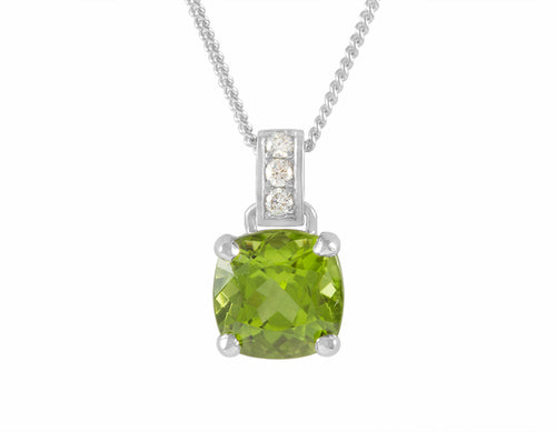 Natural apple-green peridot pendant in platinum with diamond accents.