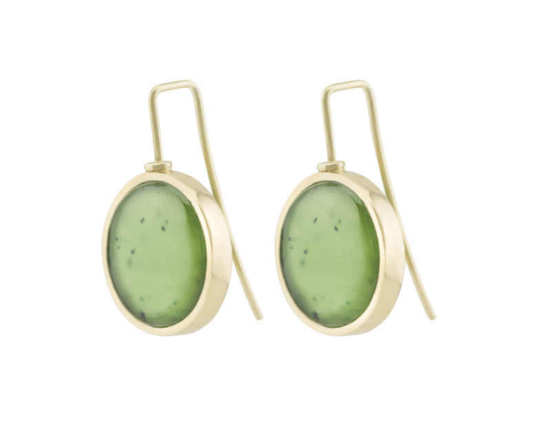Round drop earrings in yellow gold on shepherd's hooks set with large round green jade cabochon gems.