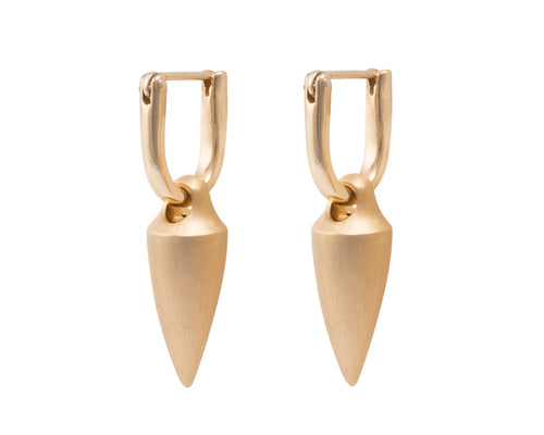 Small pointed pendulous drops in yellow gold, matte finish. Drops hang from small U shaped hoops in yellow gold.