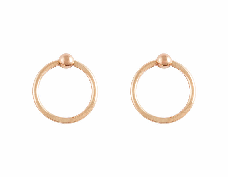 Rose gold hoops hanging on rose gold tiny ball studs.