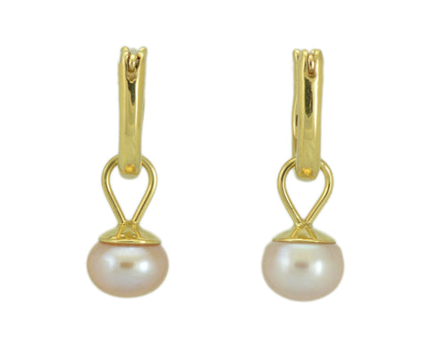 Small pink pearl drops with yellow gold caps. Drops hang from small U shaped hoops in yellow gold.