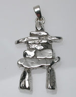 Sterling silver sculpted inukshuk pendant.