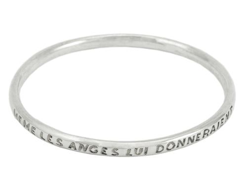 Silver bangle, round wire, with engraved text.