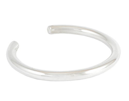 Wide round wire silver wrist cuff.