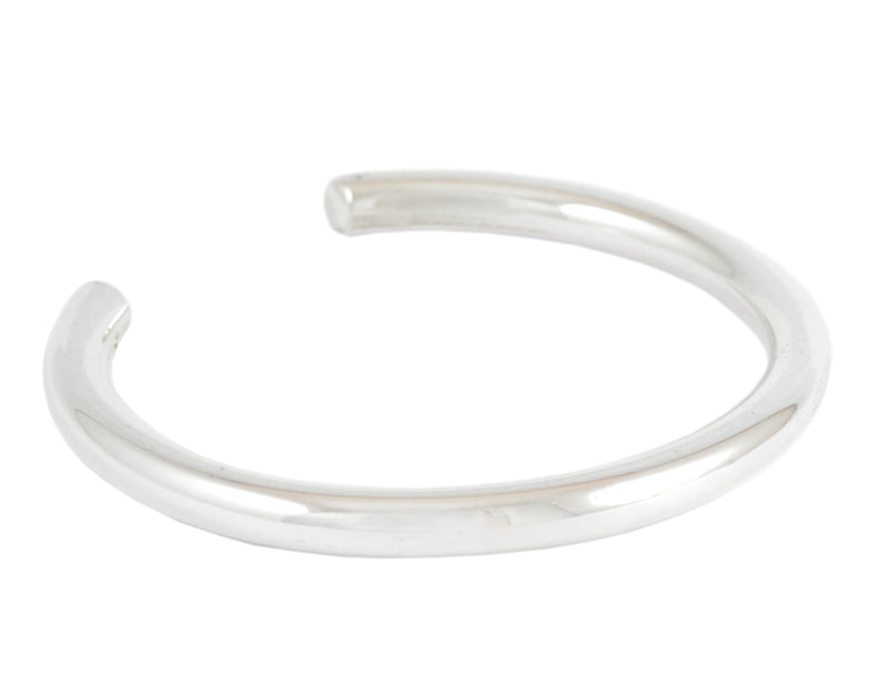 Wide round wire silver wrist cuff.