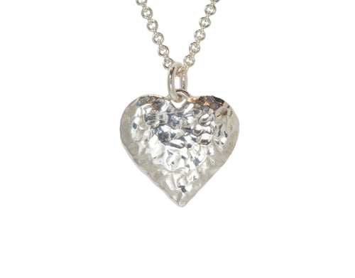 Very large hammered silver heart pendant.  Hung on silver chain.