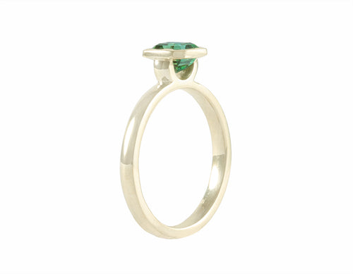 Blue-green tourmaline in 18k green gold ring.