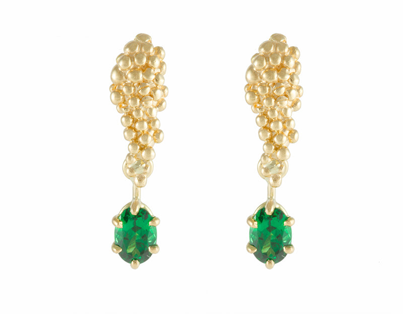 Studs in yellow gold like a bunch of grapes. Green oval gems hanging from the ends. 