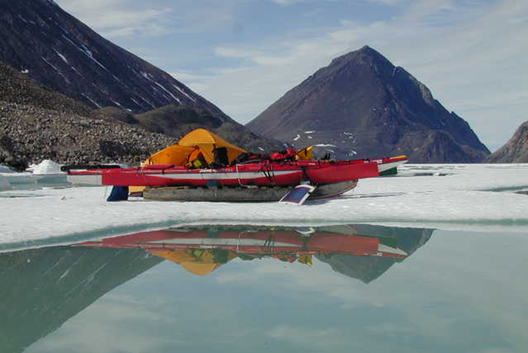 Kayak and komatik on sea ice, Pond Inlet, Nunavut.