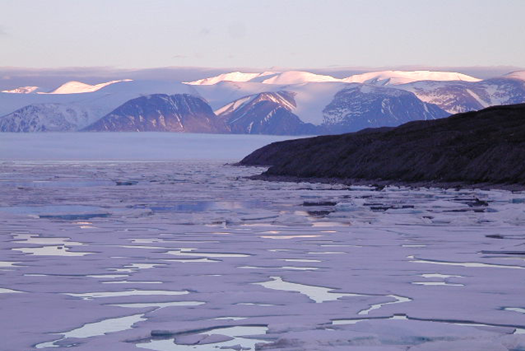 Broken sea ice, lavender coloured, evening sun, Pond Inlet, Nunavut.