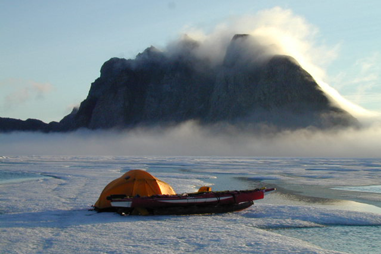 Kayak and tent on sea ice, Pond Inlet, Nunavut.