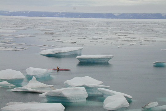 Kayak and ice pans, Arctic waters, Pond Inlet, Nunavut.