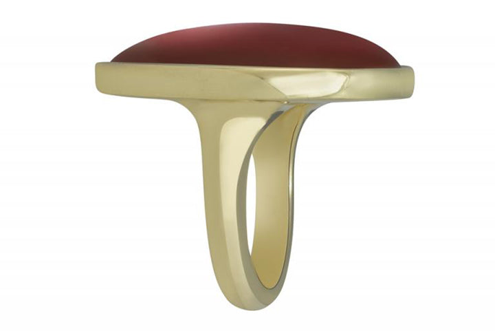 Very large smooth gem in green gold ring.