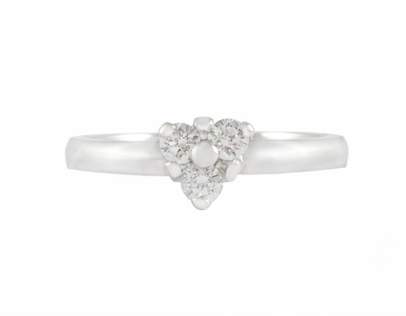 Thin platinum ring set with three diamonds forming a triangle. Gems are prong set.