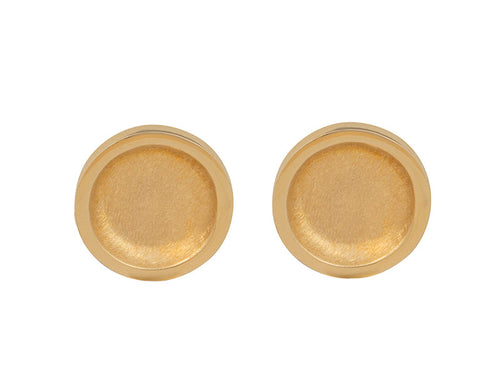 Round stud earrings in yellow gold with matte finish in bowl.