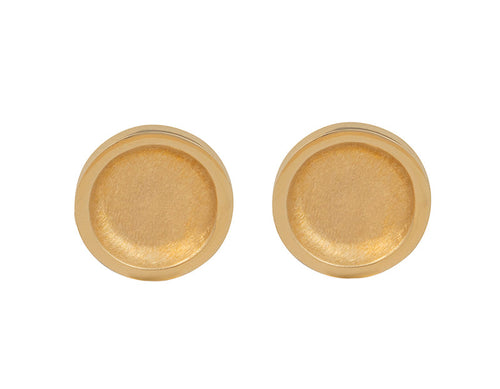 Round stud earrings in yellow gold with matte finish in bowl.