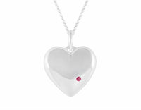 Sterling heart pendant set with a natural ruby.