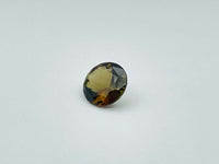 Caramel, brown, green Andalusite gem, round.
