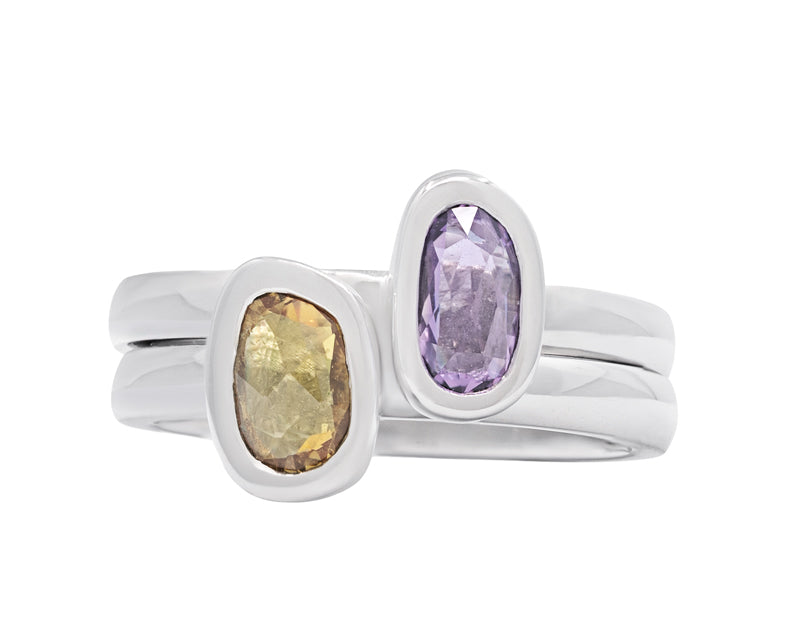 Two platinum rings with yellow and purple  sapphires.