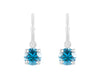 Natural blue zircon drops on platinum hoops.