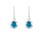 Natural blue zircon drops on platinum hoops.