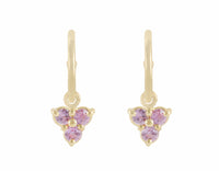 Trio of pink sapphire drops hung on yellow gold hoops.