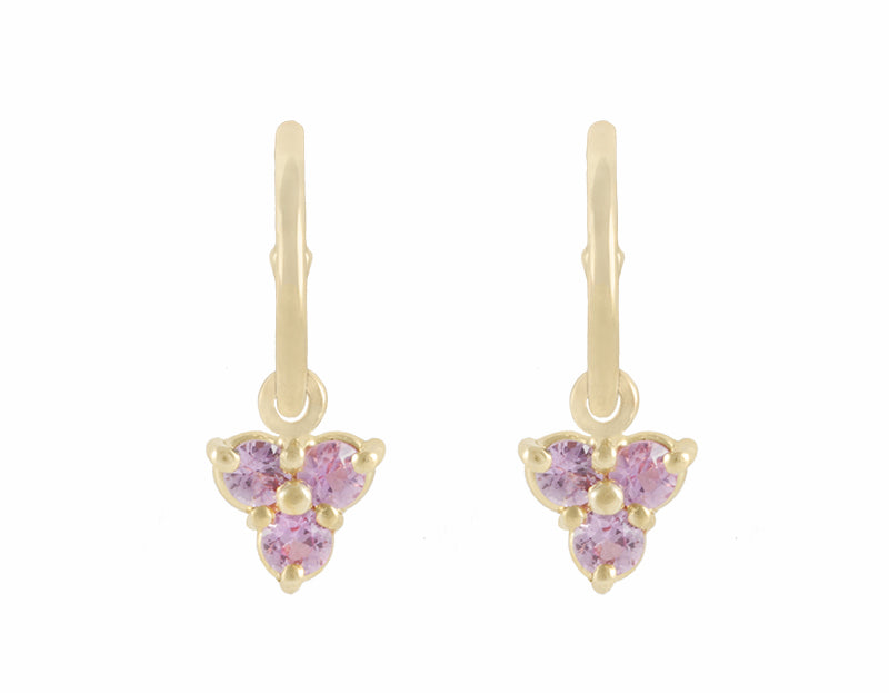 Trio of pink sapphire drops hung on yellow gold hoops.