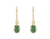 Oval, green tsavorite garnet drops on 18k yellow gold hoops.