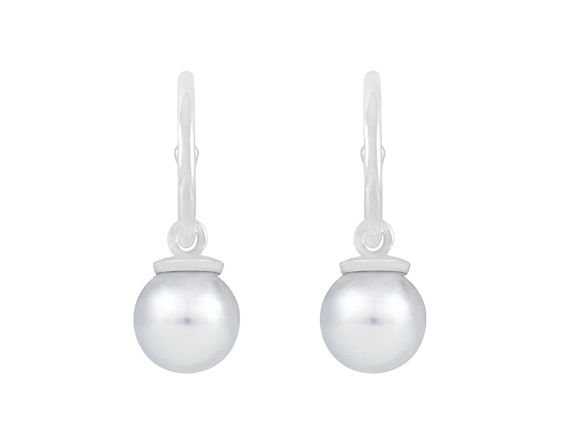 Pearl drops hung on platinum hoops.
