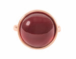 Large round cabochon of hessonite garnet in solid 18k rose gold ring.