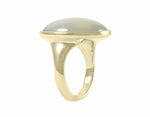 Very large oval green moonstone in 18k green gold ring