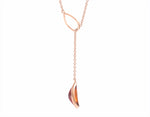 Hessonite garnet pendant, odd shape, adjustable, set in 18k and hung on 14k rose gold chain