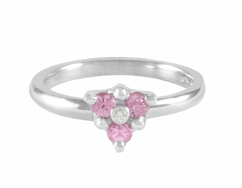 Platinum ring with pink sapphires and a diamond
