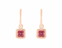 Delicate garnet drops on 18k rose gold hoops.