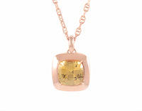 Warm honey coloured natural zircon gem set in 18k rose gold on rose gold chain.