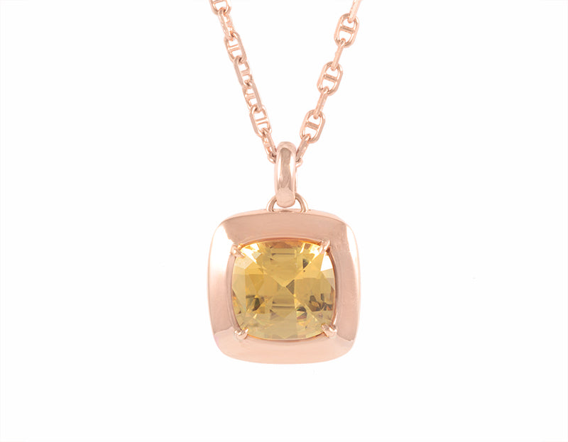 Warm honey coloured natural zircon gem set in 18k rose gold on rose gold chain.