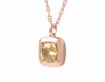 Warm honey coloured natural zircon gem set in 18k rose gold on rose gold chain.