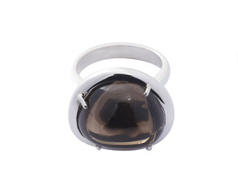 Large silver ring with oval brown gem.