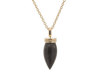 Very long pear shaped gem mottled grey and black with yellow gold cap and chain.