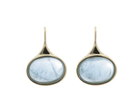 Medium oval light blue aquamarine cabochons in green gold frame and shepherd's hooks.