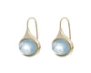 Medium oval light blue aquamarine cabochons in green gold frame and shepherd's hooks.