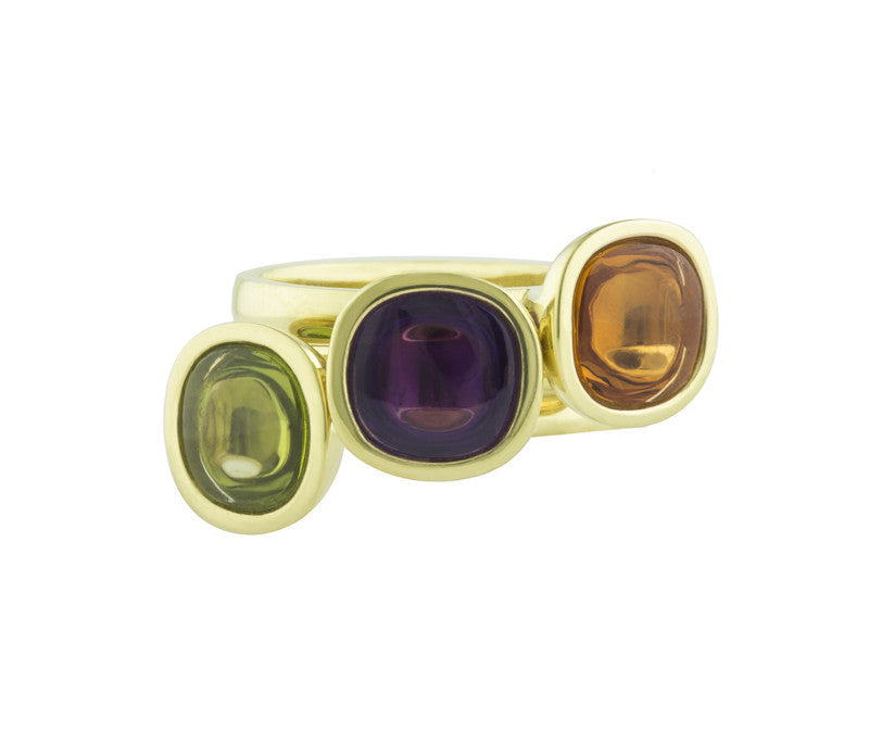 Three rings in green gold set with cushion shaped cabochons in peridot, amethyst, citrine.