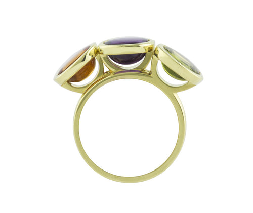 Three rings in green gold set with cushion shaped cabochons in peridot, amethyst, citrine.