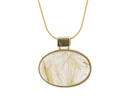 Large oval clear gem pendant with golden threads set in yellow gold frame and chain.