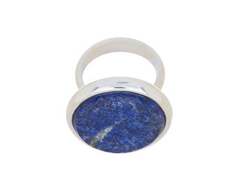 Very large silver ring, round face set with rough blue lapis lazuli.