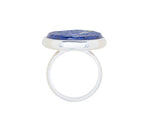 Very large silver ring, round face set with rough blue lapis lazuli.