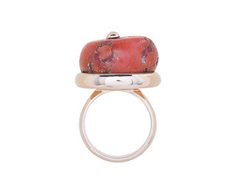 Large orange coral bead in rose gold ring.