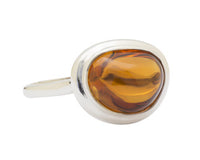 Large silver ring with oval orange gem